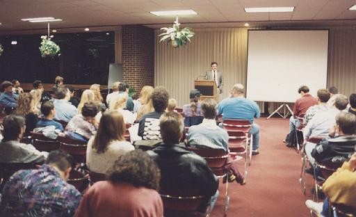 Jim Plaxco introducing Space Shuttle Astronaut Dr. Byron Lichtenberg  to an audience at Harper College - Oct. 1993.