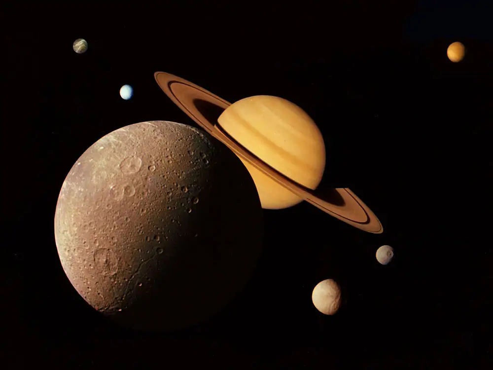 A photo montage showing Saturn, and its moons Titan, Dione, Tethys, Mimas, Enceladus, Rhea.