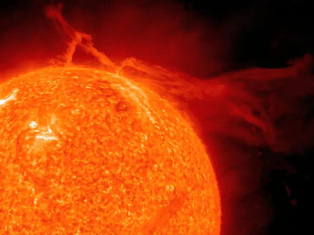 Sol, our Sun and the eruption of a solar prominence as seen in ultraviolet light.